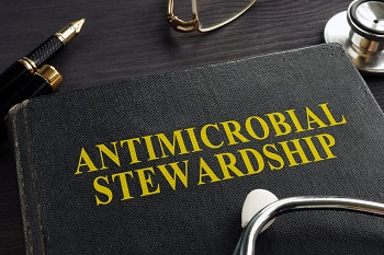 Book about Antimicrobial stewardship (AMS) and stethoscope.