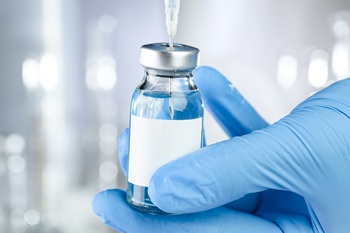 Close up view of a draw from a vial of medicine.